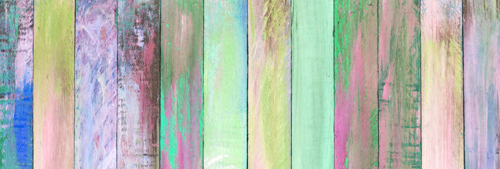 Colorful painted boards in pastel tones of pink, green and blue
