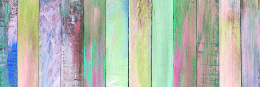 Colorful painted boards in pastel tones of pink, green and blue